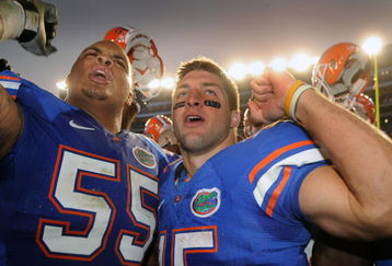 GAINESVILLE, FL - OCTOBER 17: Quarterback Tim Tebow #15  and lineman Mike Pouncey #55 of the Florida Gators celebrate a win against the University of Arkansas Razorbacks October 17, 2009 at Ben Hill Griffin Stadium in Gainesville, Florida.  (Photo by Al Messerschmidt/Getty Images)