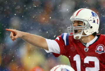 FOXBORO, MA - OCTOBER 18:  Quarterback Tom Brady #12 of the New England Patriots calls out the play as Sebastian Vollmer #76 listens in the first quarter against the Tennessee Titans on October 18, 2009 at Gillette Stadium in Foxboro, Massachusetts.  (Photo by Elsa/Getty Images)