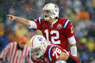 FOXBORO, MA - OCTOBER 18:  Quarterback Tom Brady #12 of the New England Patriots calls out the play as Sebastian Vollmer #76 listens in the first quarter against the Tennessee Titans on October 18, 2009 at Gillette Stadium in Foxboro, Massachusetts.  (Photo by Elsa/Getty Images)