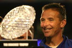 MIAMI - JANUARY 08:  Urban Meyer of the Florida Gators smiles as he is presented with the National Championship trophy after their 24-14 win against the Oklahoma Sooners during the FedEx BCS National Championship game at Dolphin Stadium on January 8, 2009 in Miami, Florida.  (Photo by Marc Serota/Getty Images)
