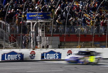 CONCORD, NC - OCTOBER 17:  Jimmie Johnson, driver of the #48 Lowe's Chevrolet, crosses the finish line to win the NASCAR Sprint Cup Series NASCAR Banking 500 at Lowe's Motor Speedway on October 17, 2009 in Concord, North Carolina.  (Photo by Geoff Burke/Getty Images for NASCAR)