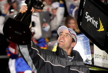 CONCORD, NC - OCTOBER 17:  Jimmie Johnson, driver of the #48 Lowe's Chevrolet, holds up the trophy after winning the NASCAR Sprint Cup Series NASCAR Banking 500 at Lowe's Motor Speedway on October 17, 2009 in Concord, North Carolina.  (Photo by Rusty Jarrett/Getty Images for NASCAR)