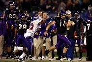 SAN DIEGO, CA - DECEMBER 23:  Quarterback Andy Dalton #14 of  TCU runs with the ball against the tackle of Safety Jeron Johnson #23 of Boise State during the San Diego County Credit Union Poinsettia Bowl at Qualcomm Stadium on December 23, 2008 in San Diego, California. (Photo by Donald Miralle/Getty Images)