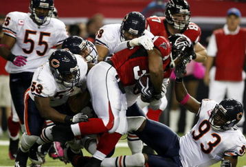 ATLANTA - OCTOBER 18:  Running back Michael Turner #33 of the Atlanta Falcons is tackled by the Chicago Bears defense in the game at the Georgia Dome on October 18, 2009 in Atlanta, Georgia. (Photo by Kevin C. Cox/Getty Images)