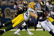 ST. LOUIS, MO - SEPTEMBER 27: Clay Matthews #52 of the Green Bay Packers tackles Keenan Burton #14 of the St. Louis Rams at the Edward Jones Dome on September 27, 2009 in St. Louis, Missouri.  The Packers beat the Rams 36-17.  (Photo by Dilip Vishwanat/Getty Images)