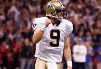 NEW ORLEANS - OCTOBER 18:  Drew Brees #9 of the New Orleans Saints celebrates after watching Mike Bell #21 score a touchdown against the New York Giants at the Louisiana Superdome on October 18, 2009 in New Orleans, Louisiana.  (Photo by Chris Graythen/Getty Images)