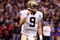 NEW ORLEANS - OCTOBER 18:  Drew Brees #9 of the New Orleans Saints celebrates after watching Mike Bell #21 score a touchdown against the New York Giants at the Louisiana Superdome on October 18, 2009 in New Orleans, Louisiana.  (Photo by Chris Graythen/Getty Images)