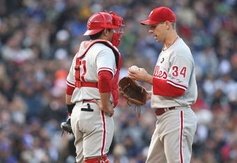 DENVER - OCTOBER 11:  Cliff Lee #34 of the Philadelphia Phillies talks to catcher Carlos Ruiz #51 on the mound against the Colorado Rockies in Game Four of the NLDS during the 2009 MLB Playoffs at Coors Field on October 12, 2009 in Denver, Colorado. (Photo by Jed Jacobsohn/Getty Images)