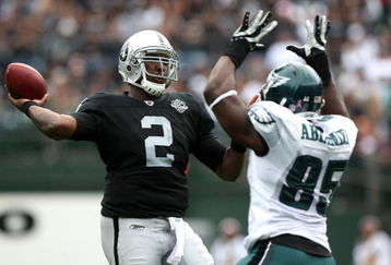 OAKLAND, CA - OCTOBER 18:   JaMarcus Russell #2 of the Oakland Raiders passes against Victor Abiamiri #95 of the Philadelphia Eagles during an NFL game at the Oakland-Alameda County Coliseum on October 18, 2009 in Oakland, California. (Photo by Jed Jacobsohn/Getty Images)