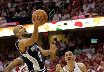 CLEVELAND - JUNE 14: Tony Parker #9 of the San Antonio Spurs shoots a layup against Sasha Pavlovic #3 of the Cleveland Cavaliers in Game Four of the NBA Finals on June 14, 2007 at the Quicken Loans Arena in Cleveland, Ohio. NOTE TO USER: User expressly acknowledges and agrees that, by downloading and or using this photograph, User is consenting to the terms and conditions of the Getty Images License Agreement.  (Photo by Lisa Blumenfeld/Getty Images)