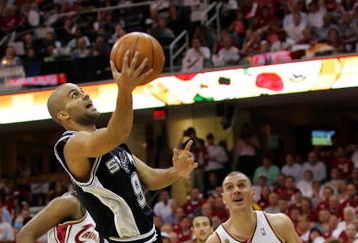 CLEVELAND - JUNE 14: Tony Parker #9 of the San Antonio Spurs shoots a layup against Sasha Pavlovic #3 of the Cleveland Cavaliers in Game Four of the NBA Finals on June 14, 2007 at the Quicken Loans Arena in Cleveland, Ohio. NOTE TO USER: User expressly acknowledges and agrees that, by downloading and or using this photograph, User is consenting to the terms and conditions of the Getty Images License Agreement.  (Photo by Lisa Blumenfeld/Getty Images)