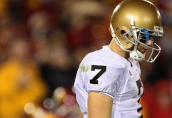 LOS ANGELES, CA - NOVEMBER 29:  Quarterback Jimmy Clausen #7 of the Notre Dame Fighting looks down during the first half against the USC Trojans at the Memorial Coliseum on November 29, 2008 in Los Angeles, California. USC defeated Notre Dame 38-3.  (Photo by Jeff Gross/Getty Images)