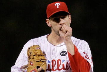 PHILADELPHIA - OCTOBER 18:  Cliff Lee #34 of the Philadelphia Phillies warms his hand while pitching against the Los Angeles Dodgers during Game Three of the NLCS during the 2009 MLB Playoffs at Citizens Bank Park on October 18, 2009 in Philadelphia, Pennsylvania.  (Photo by Pool/Getty Images)