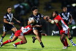 ROTORUA, NEW ZEALAND - OCTOBER 14: Issac Luke of the Kiwis is tackled by Eliakim Uasi of Tonga during the International Rugby League Federation Test match between the New Zealand Kiwis and Tonga at Rotorua International Stadium on October 14, 2009 in Rotorua, New Zealand.  (Photo by Phil Walter/Getty Images)