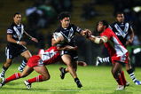 ROTORUA, NEW ZEALAND - OCTOBER 14: Issac Luke of the Kiwis is tackled by Eliakim Uasi of Tonga during the International Rugby League Federation Test match between the New Zealand Kiwis and Tonga at Rotorua International Stadium on October 14, 2009 in Rotorua, New Zealand.  (Photo by Phil Walter/Getty Images)