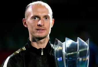 SHANGHAI, CHINA - OCTOBER 18:  Nikolay Davydenko of Russia poses for photographers after defeating Rafael Nadal of Spain during the final on day eight of the 2009 Shanghai ATP Masters 1000 at Qi Zhong Tennis Centre on October 18, 2009 in Shanghai, China.  (Photo by Matthew Stockman/Getty Images)