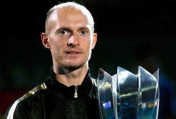 SHANGHAI, CHINA - OCTOBER 18:  Nikolay Davydenko of Russia poses for photographers after defeating Rafael Nadal of Spain during the final on day eight of the 2009 Shanghai ATP Masters 1000 at Qi Zhong Tennis Centre on October 18, 2009 in Shanghai, China.  (Photo by Matthew Stockman/Getty Images)