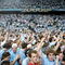CHAPEL HILL, NC - MARCH 6:  Fans of the North Carolina Tar Heels celebrate winning the ACC Regular Season Championship on the court after their game against the Duke Blue Devils on March 6, 2005 at the Dean E. Smith Center in Chapel Hill, North Carolina. The Tar Heels defeated the Blue Devils 75-73.  (Photo by Streeter Lecka/Getty Images)