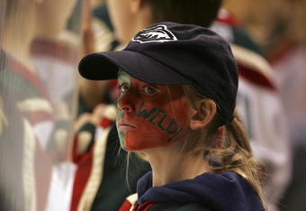 SAINT PAUL, MN - JANUARY 9: A young fan of the Minnesota Wild watches warm-ups prior to the Wild game against the Dallas Stars at the Xcel Energy Center on January 9, 2006 in Saint Paul, Minnesota. (Photo by Bruce Bennett/Getty Images)