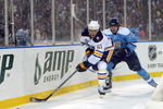 ORCHARD PARK, NY - JANUARY 01:  Colby Armstrong #20 of the Pittsburgh Penguins challenges Maxim Afinegenov #61 of the Buffalo Sabres during the NHL Winter Classic at the Ralph Wilson Stadium on January 1, 2008 in Orchard Park, New York.  The Penguins won the game 2-1 in a shoot out.  (Photo by Dave Sandford/Getty Images)