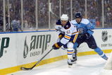 ORCHARD PARK, NY - JANUARY 01:  Colby Armstrong #20 of the Pittsburgh Penguins challenges Maxim Afinegenov #61 of the Buffalo Sabres during the NHL Winter Classic at the Ralph Wilson Stadium on January 1, 2008 in Orchard Park, New York.  The Penguins won the game 2-1 in a shoot out.  (Photo by Dave Sandford/Getty Images)