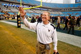 CHARLOTTE, NC - DECEMBER 27:  Head coach Bill Stewart of the West Virginia Mountaineers celebrates after a 31-30 victory over the North Carolina Tar Heels after the Meineke Car Care Bowl on December 27, 2008 at Bank of America Stadium in Charlotte, North Carolina.  (Photo by Streeter Lecka/Getty Images)