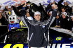 CONCORD, NC - OCTOBER 17:  Jimmie Johnson, driver of the #48 Lowe's Chevrolet, holds up the trophy after winning the NASCAR Sprint Cup Series NASCAR Banking 500 at Lowe's Motor Speedway on October 17, 2009 in Concord, North Carolina.  (Photo by John Harrelson/Getty Images for NASCAR)