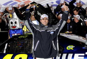 CONCORD, NC - OCTOBER 17:  Jimmie Johnson, driver of the #48 Lowe's Chevrolet, holds up the trophy after winning the NASCAR Sprint Cup Series NASCAR Banking 500 at Lowe's Motor Speedway on October 17, 2009 in Concord, North Carolina.  (Photo by John Harrelson/Getty Images for NASCAR)