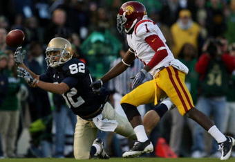SOUTH BEND, IN - OCTOBER 17:  Center back T.J. Bryant #1 of the USC Trojans watches as Robby Parris #82 of the Notre Dame Fighting Irish misses the catch during the third quarter of the game at Notre Dame Stadium on October 17, 2009 in South Bend, Indiana. (Photo by Jonathan Daniel/Getty Images)