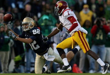 SOUTH BEND, IN - OCTOBER 17:  Center back T.J. Bryant #1 of the USC Trojans watches as Robby Parris #82 of the Notre Dame Fighting Irish misses the catch during the third quarter of the game at Notre Dame Stadium on October 17, 2009 in South Bend, Indiana. (Photo by Jonathan Daniel/Getty Images)