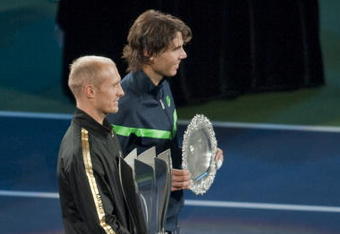 SHANGHAI, CHINA - OCTOBER 18:  Nikolay Davydenko of Russia and Rafael Nadal of Spain pose for photographers after the final on day eight of 2009 Shanghai ATP Masters 1000 at Qi Zhong Tennis Centre on October 18, 2009 in Shanghai China.  (Photo by Victor Fraile/Getty Images)
