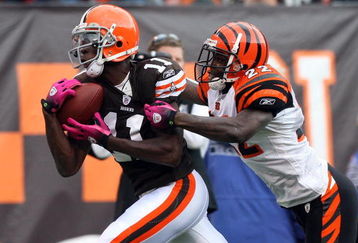 CLEVELAND - OCTOBER 04: Mohamed Massaquoi #11 of the Cleveland Browns makes a catch at the 1 yard line against Jonathan Joseph #22 of the Cincinnati Bengals during their game at Cleveland Browns Stadium on October 4, 2009 in Cleveland, Ohio.  (Photo by Jim McIsaac/Getty Images)
