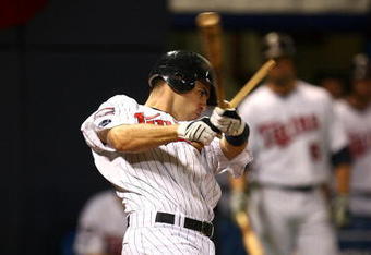 MINNEAPOLIS - OCTOBER 11: Joe Mauer #7 of the Minnesota Twins shatters his bat hitting against the New York Yankees in Game Three of the ALDS during the 2009 MLB Playoffs at the Hubert H. Humphrey Metrodome on October 11, 2009 in Minneapolis, Minnesota. (Photo by Jonathan Daniel/Getty Images)