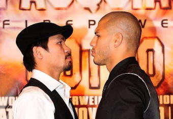 BEVERLY HILLS, CA - SEPTEMBER 14:  Manny Pacquiao and  Miguel Cotto pose for pictures during the press conference at the Beverly Hills Hotel on September 14, 2009 in Beverly Hills, California.  (Photo by Jacob de Golish/Getty Images)