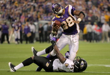 MINNEAPOLIS - OCTOBER 18:  Running back Adrian Peterson #28 of the Minnesota Vikings grimmaces as he is tackled by Dannell Ellerbe #59 of the Baltimore Ravens in the fourth quarter during NFL action at Hubert H. Humphrey Metrodome on October 18, 2009 in Minneapolis, Minnesota. The Vikings defeated the Ravens 33-31.  (Photo by Doug Pensinger/Getty Images)