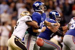 NEW ORLEANS - OCTOBER 18:  Roman Harper #41 of the New Orleans Saints forces a fumble by quarterback Eli Manning #10 of the New York Giants at the Louisiana Superdome on October 18, 2009 in New Orleans, Louisiana.  (Photo by Chris Graythen/Getty Images)