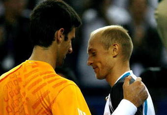 SHANGHAI, CHINA - OCTOBER 17:  Novak Djokovic of Serbia congratulates Nikolay Davydenko of Russia after their match during the semifinal round on day seven of the 2009 Shanghai ATP Masters 1000 at Qi Zhong Tennis Centre on October 17, 2009 in Shanghai, China.  (Photo by Matthew Stockman/Getty Images)