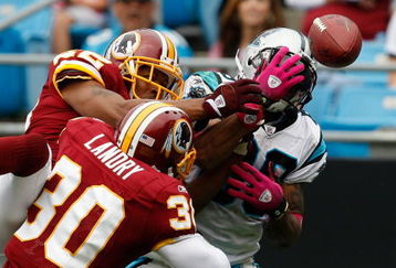 CHARLOTTE, NC - OCTOBER 11:  Steve Smith #89 of the Carolina Panthers has a pass broken up by Carlos Rogers #22 and teammate LaRon Landry #30 of the Washington Redskins at Bank of America Stadium on October 11, 2009 in Charlotte, North Carolina.  (Photo by Streeter Lecka/Getty Images)