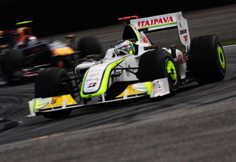 SAO PAULO, BRAZIL - OCTOBER 18:  Jenson Button of Great Britain and Brawn GP drives on his way clinching the F1 World Drivers Championship during the Brazilian Formula One Grand Prix at the Interlagos Circuit on October 18, 2009 in Sao Paulo, Brazil.  (Photo by Clive Mason/Getty Images)