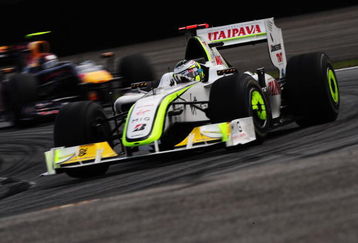 SAO PAULO, BRAZIL - OCTOBER 18:  Jenson Button of Great Britain and Brawn GP drives on his way clinching the F1 World Drivers Championship during the Brazilian Formula One Grand Prix at the Interlagos Circuit on October 18, 2009 in Sao Paulo, Brazil.  (Photo by Clive Mason/Getty Images)
