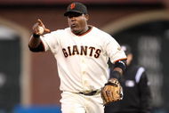 SAN FRANCISCO - AUGUST 26:  Juan Uribe #5 of the San Francisco Giants points to Edgar Renteria #16 made a good play to end the second inning of their game against the Arizona Diamondbacks at AT&T Park on August 26, 2009 in San Francisco, California.  (Photo by Ezra Shaw/Getty Images for Reebok)