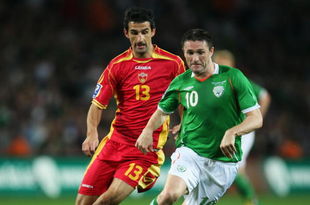 DUBLIN, IRELAND - OCTOBER 14: Robbie Keane of the Republic of Ireland avoids Mitar Novakovic of Montenegro during the FIFA 2010 World Cup European Qualifying match between the Republic of Ireland and Montenegro at Croke Park on October 14, 2009 in Dublin, Ireland. (Photo by Bryn Lennon/Getty Images)
