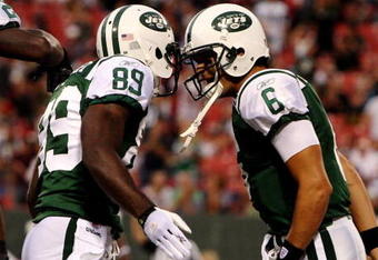 EAST RUTHERFORD, NJ - SEPTEMBER 3:  Quarterback MarkSanchez #6 and wide receiver Jerricho Cotchery #89 of the New York Jets celebrate a first quarter touchdown against the Philadelphia Eagles during the NFL preseason game at Giants Stadium on September 3, 2009 in East Rutherford, New Jersey. (Photo by Jim McIsaac/Getty Images)