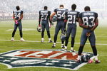 SEATTLE, WA - OCTOBER 18:  Members of the Seattle Seahawks listen to the national anthem prior to the game against the Arizona Cardinals at Qwest Field on October 18, 2009 in Seattle, Washington.  (Photo by Jonathan Ferrey/Getty Images)