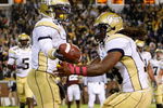 ATLANTA - OCTOBER 17:  Marcus Wright #3 of the Georgia Tech Yellow Jackets celebrates his touchdown with Anthony Allen #18 against the Virginia Tech Hokies at Bobby Dodd Stadium on October 17, 2009 in Atlanta, Georgia.  (Photo by Kevin C. Cox/Getty Images)
