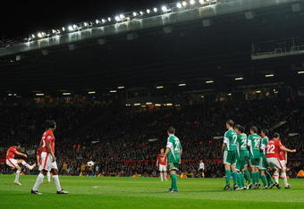MANCHESTER, ENGLAND - SEPTEMBER 30:  Ryan Giggs of Manchester United scores his team's first goal during the UEFA Champions League Group B match between Manchester United and VfL Wolfsburg at Old Trafford on September 30, 2009 in Manchester, England.  (Photo by Laurence Griffiths/Getty Images)