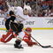 DETROIT - MAY 14: Andrew Ebbett #48 of the Anaheim Ducks can't get around the stick of Brad Stuart #23 of the Detroit Red Wings during Game Seven of the Western Conference Semifinals of the 2009 NHL Stanley Cup Playoffs on May 14, 2009 at Joe Louis Arena in Detroit, Michigan.  (Photo by Gregory Shamus/Getty Images)