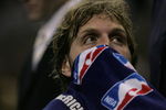 SAN ANTONIO - MAY 17:  Dirk Nowitzki #41 of the Dallas Mavericks covers his face with a towel as he looks on from the bench against the San Antonio Spurs in Game Five of the Western Conference Semifinals during the 2006 NBA Playoffs May 17, 2006 at AT&T Center in San Antonio, Texas. NOTE TO USER: User expressly acknowledges and agrees that, by downloading and or using this photograph, User is consenting to the terms and conditions of the Getty Images License Agreement.  (Photo by Stephen Dunn/Getty Images)