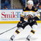 UNIONDALE, NY - APRIL 12:  Chuck Kobasew #12 of the Boston Bruins skates against the New York Islanders on April 12, 2009 at Nassau Coliseum in Uniondale, New York. The Bruins won the game 6-2.  (Photo by Jim McIsaac/Getty Images)