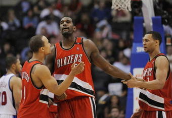 LOS ANGELES, CA - JANUARY 26: Greg Oden #52 of the Portland Trail Blazers celebrates with teammates Brandon Roy #7 and Jerryd Bayless #4 during their game against the Los Angeles Clippers at Staples Center January 26, 2009 in Los Angeles, California. NOTE TO USER: User expressly acknowledges and agrees that, by downloading and/or using this Photograph, user is consenting to the terms and conditions of the Getty Images License Agreement. (Photo by Kevork Djansezian/Getty Images)